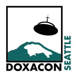 The Doxacon Seattle logo: a flying saucer with a cross atop it hovering over Mount Rainier